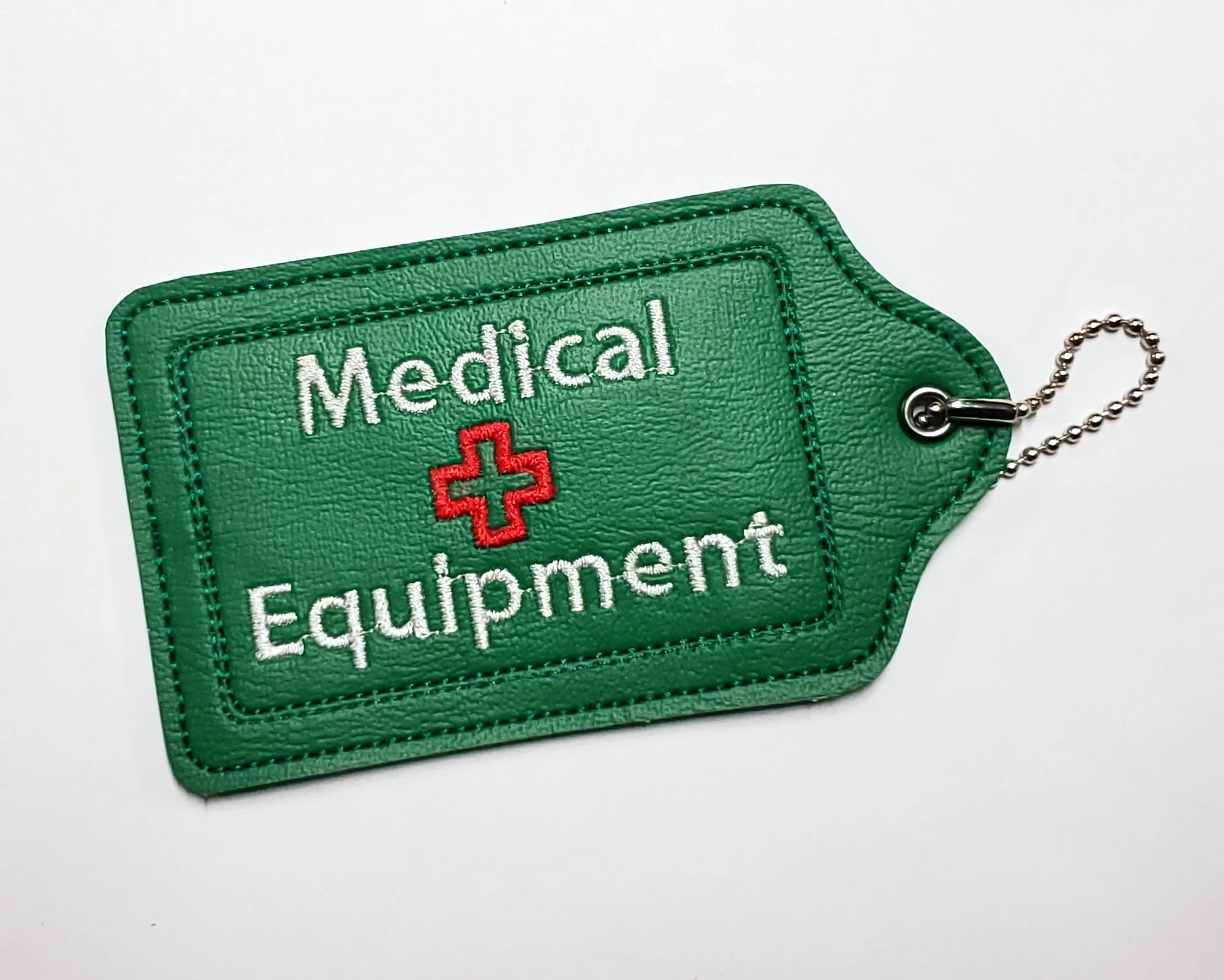 Green Medical Equipment Luggage Tag with Rainbow print