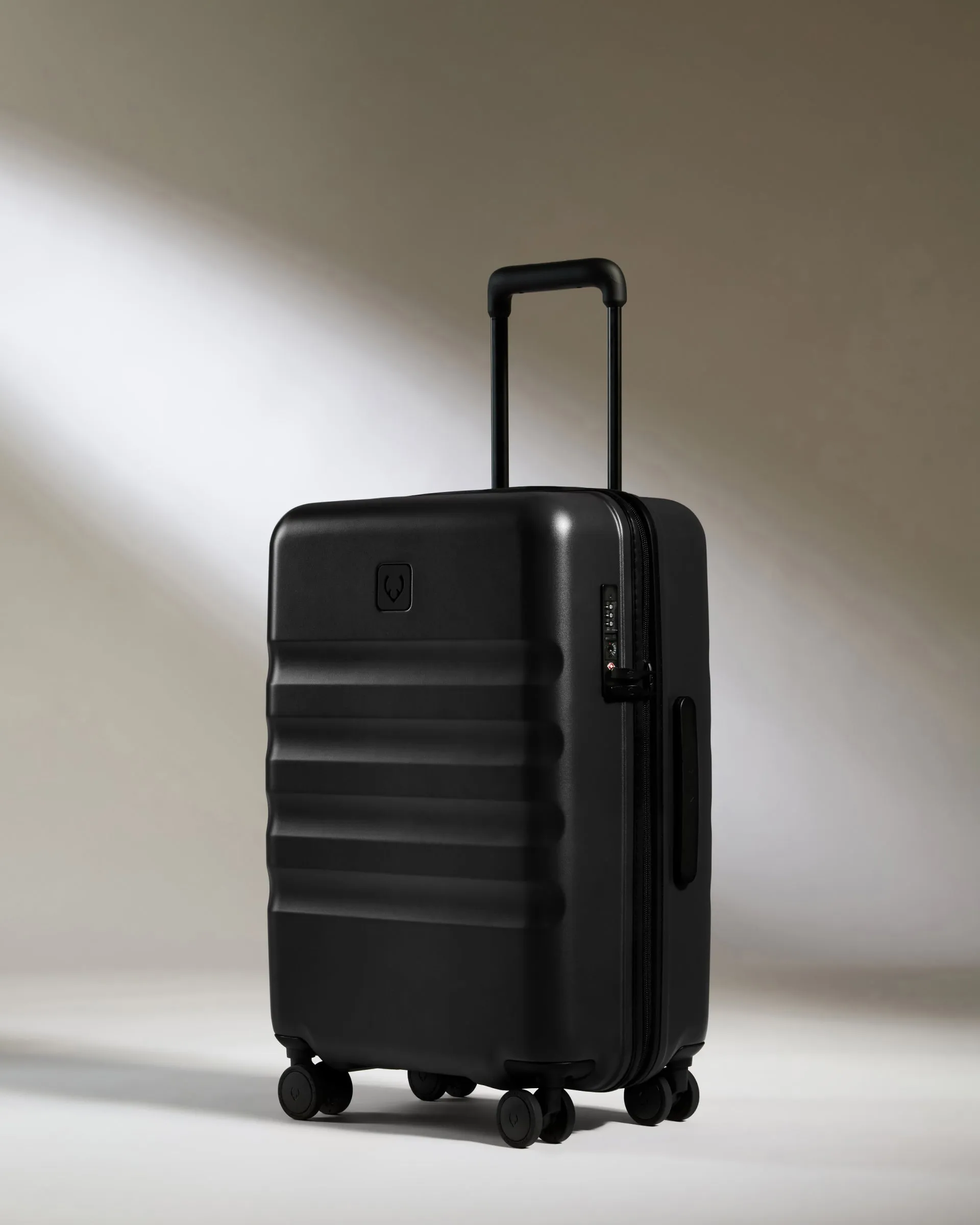 Large Cabin Suitcase in Black - Icon Stripe